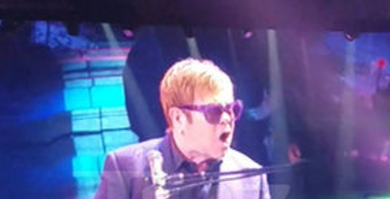 Crazed Fan Keeps Trying To Touch Elton John During Concert: “You Fucked It Up!”