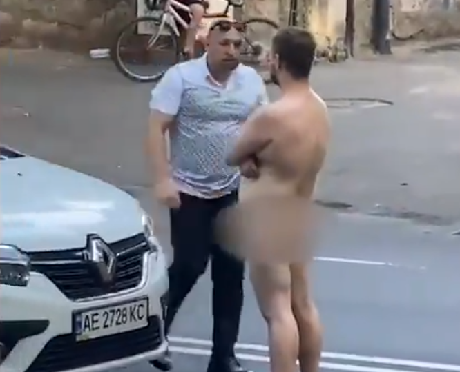 Naked Man Blocking Traffic Knocked Out By Angry Motorist