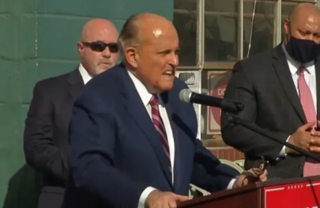 Trump Presidency Ends With Rudy Giuliani Press Conference Between Porn Shop And Crematorium