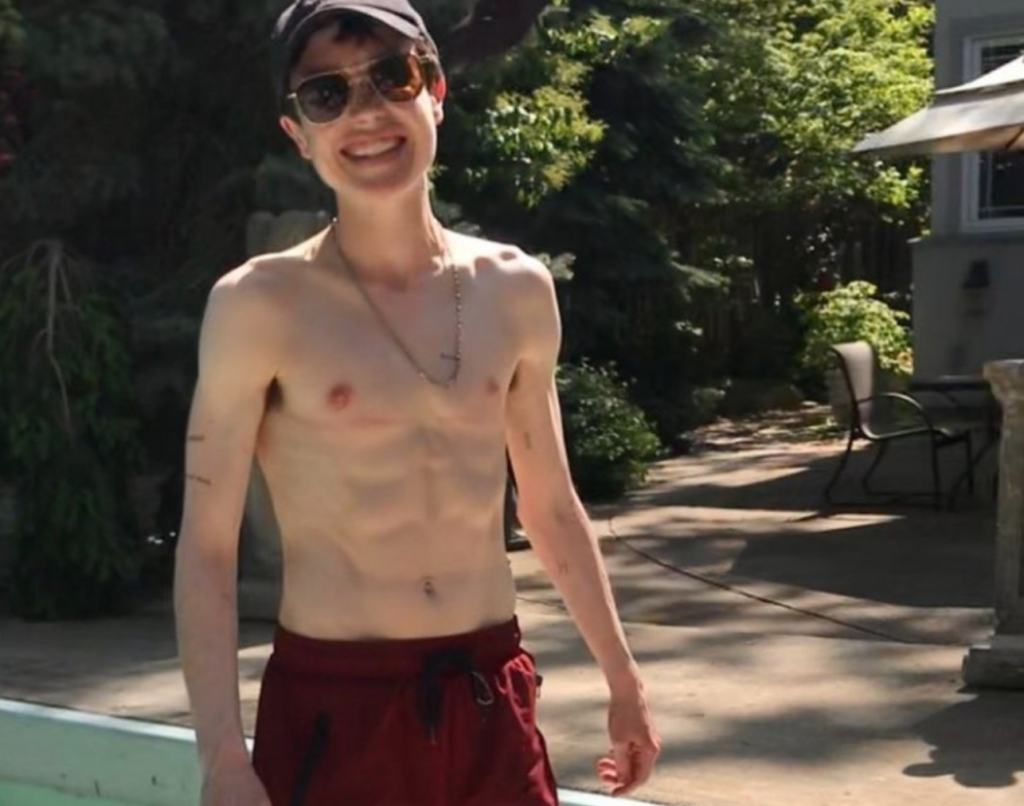 Elliot Page Shares Shirtless Poolside Photo: “First Swim Trunks”