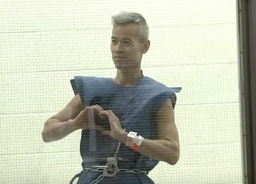 Attempted Mass Murderer Flashes Heart Sign While Being Arraigned In L.A.